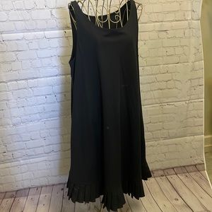 Black sleeveless tunic style with ruffle